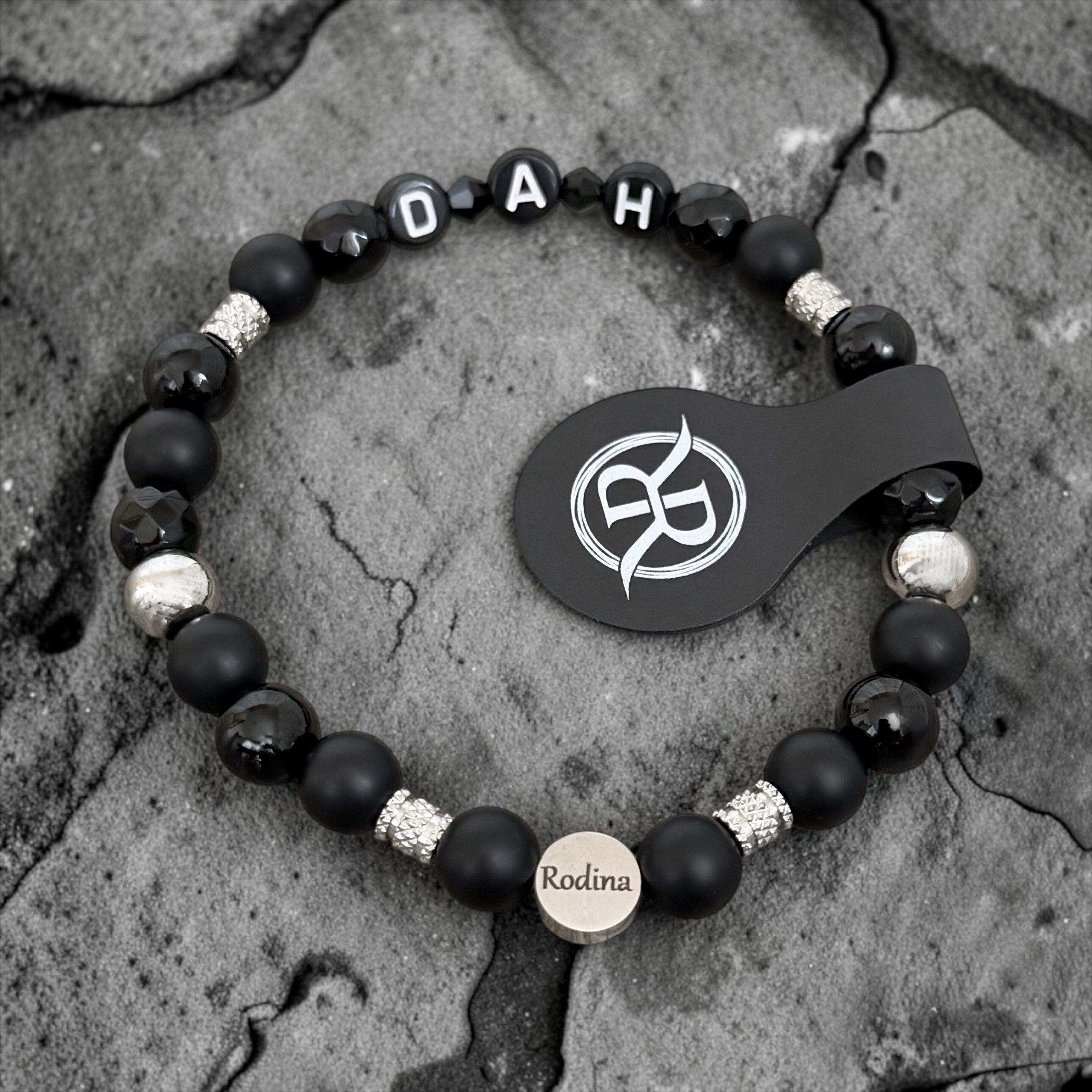 A bracelet engraved with the word ‘Family’, made from natural onyx stones, with letters of your choice