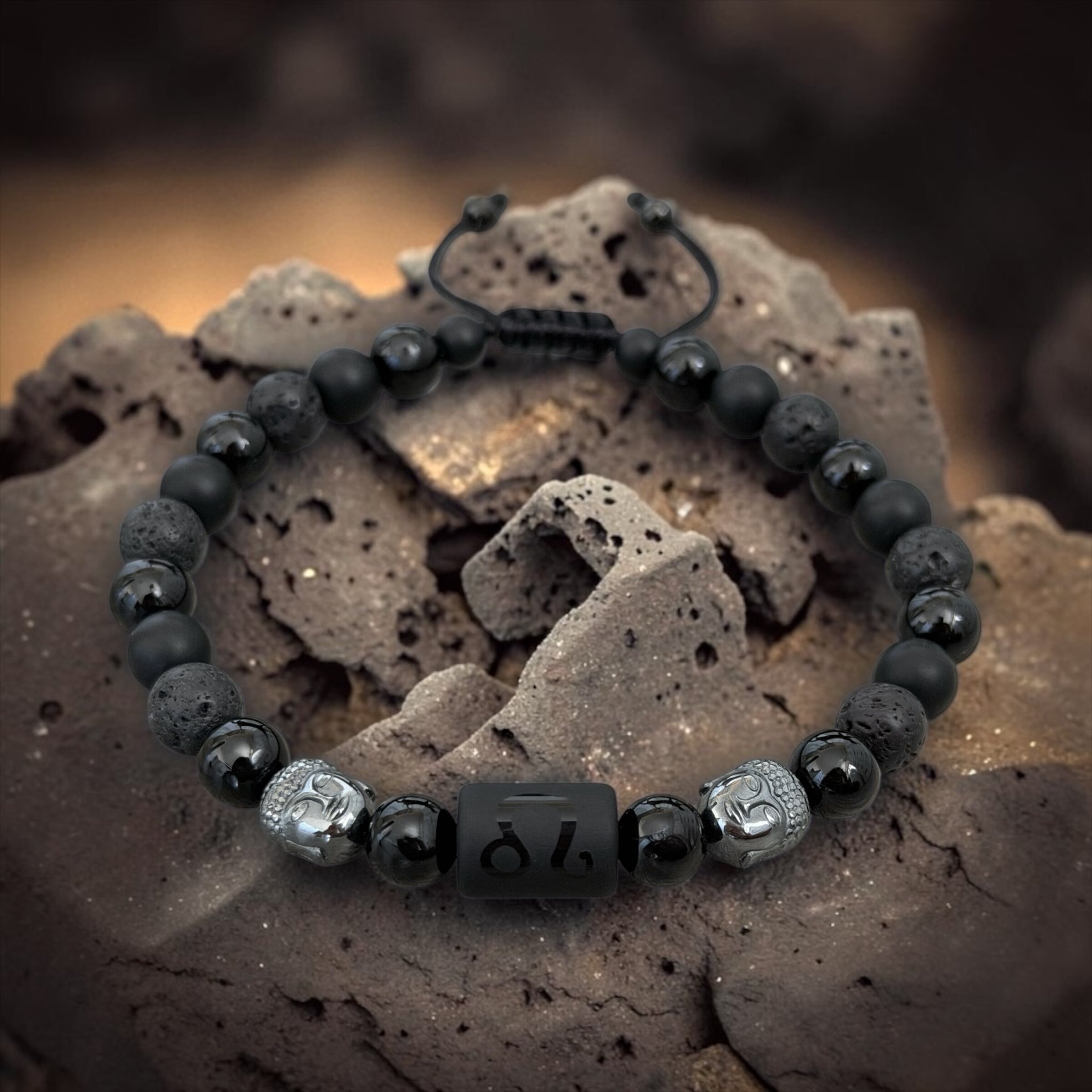 A bracelet featuring zodiac signs and Buddha heads, made from natural onyx and lava stones
