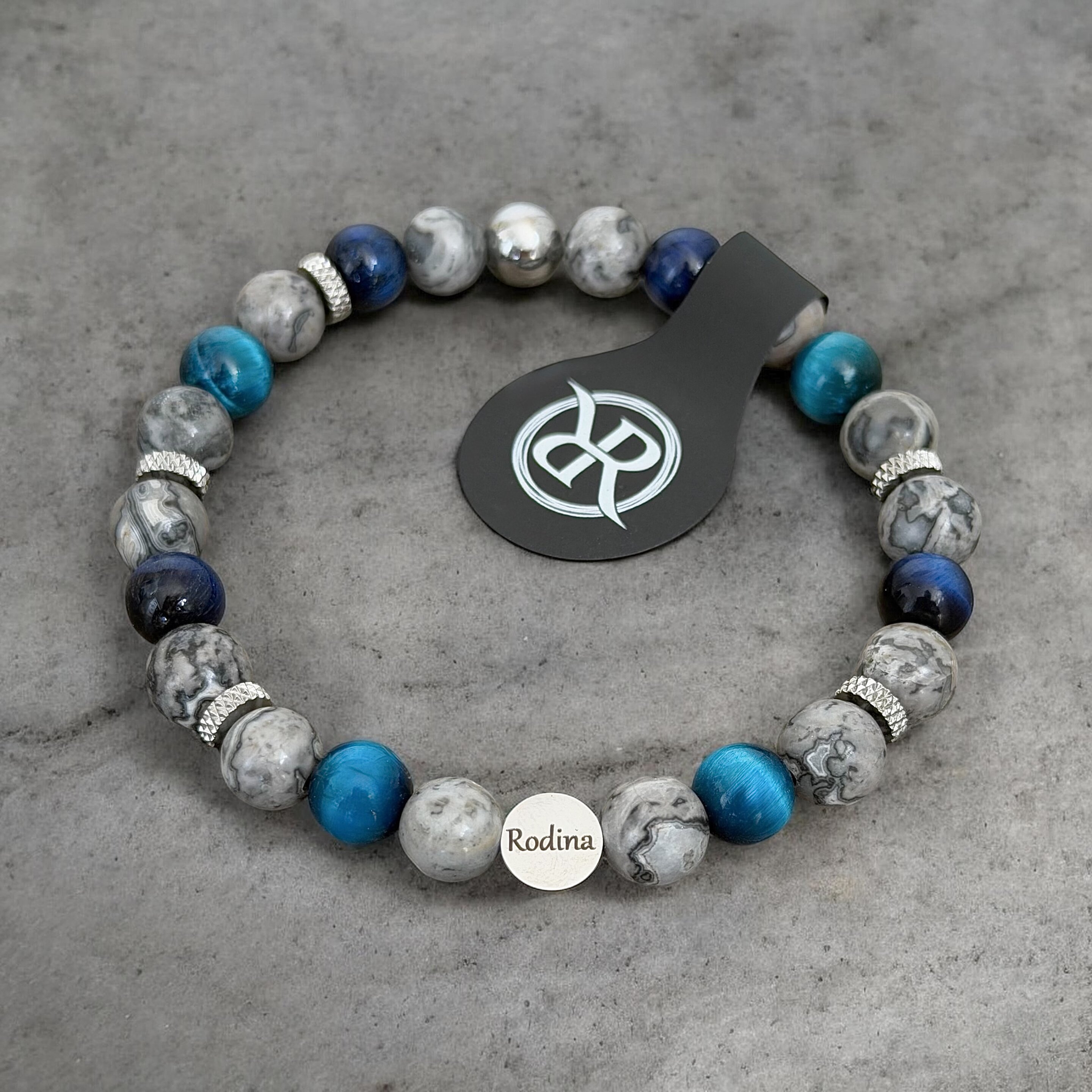 A bracelet made from natural stones with the word ‘Family’ engraved on it