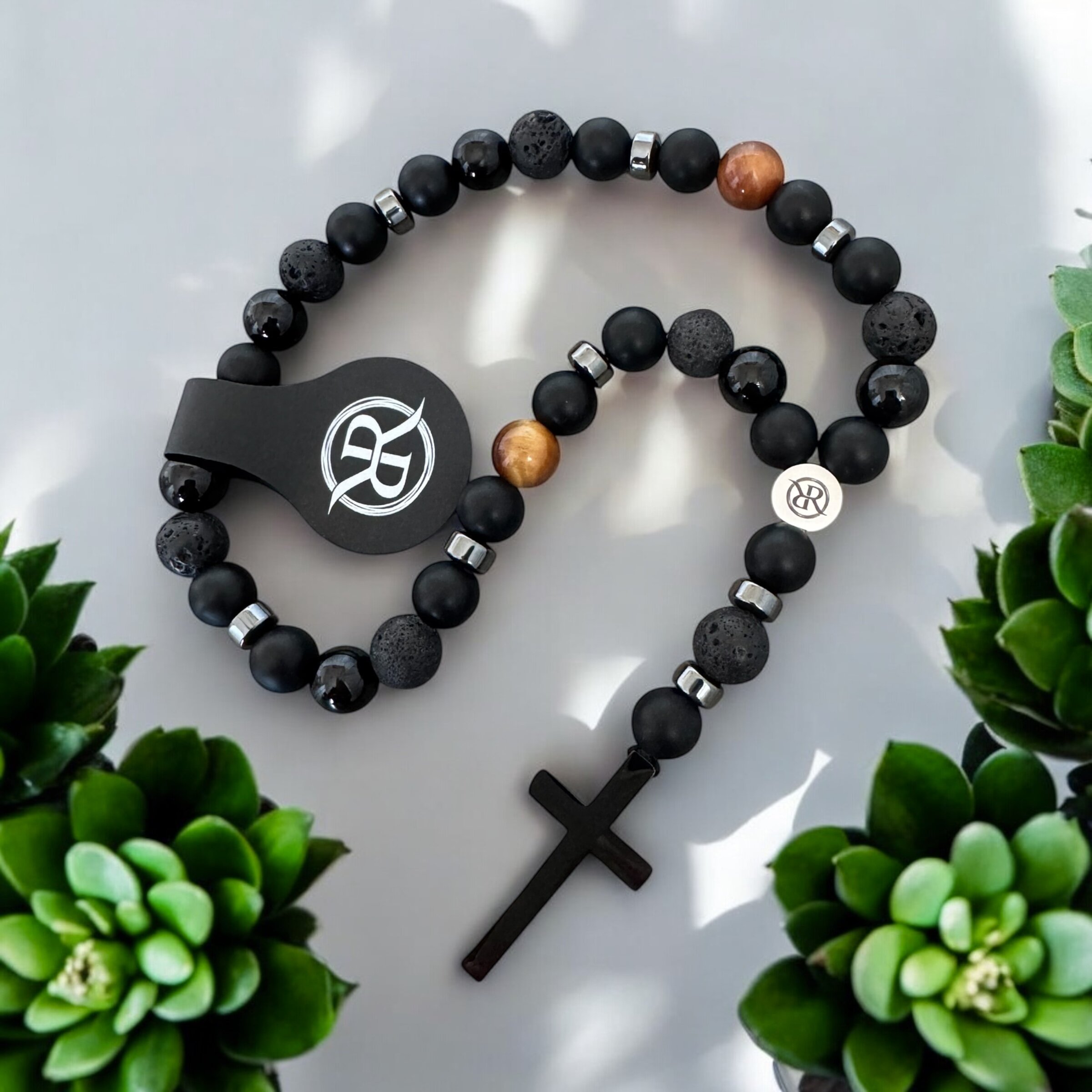 A car rosary for the rear-view mirror, made from natural onyx, lava and tiger’s eye stones