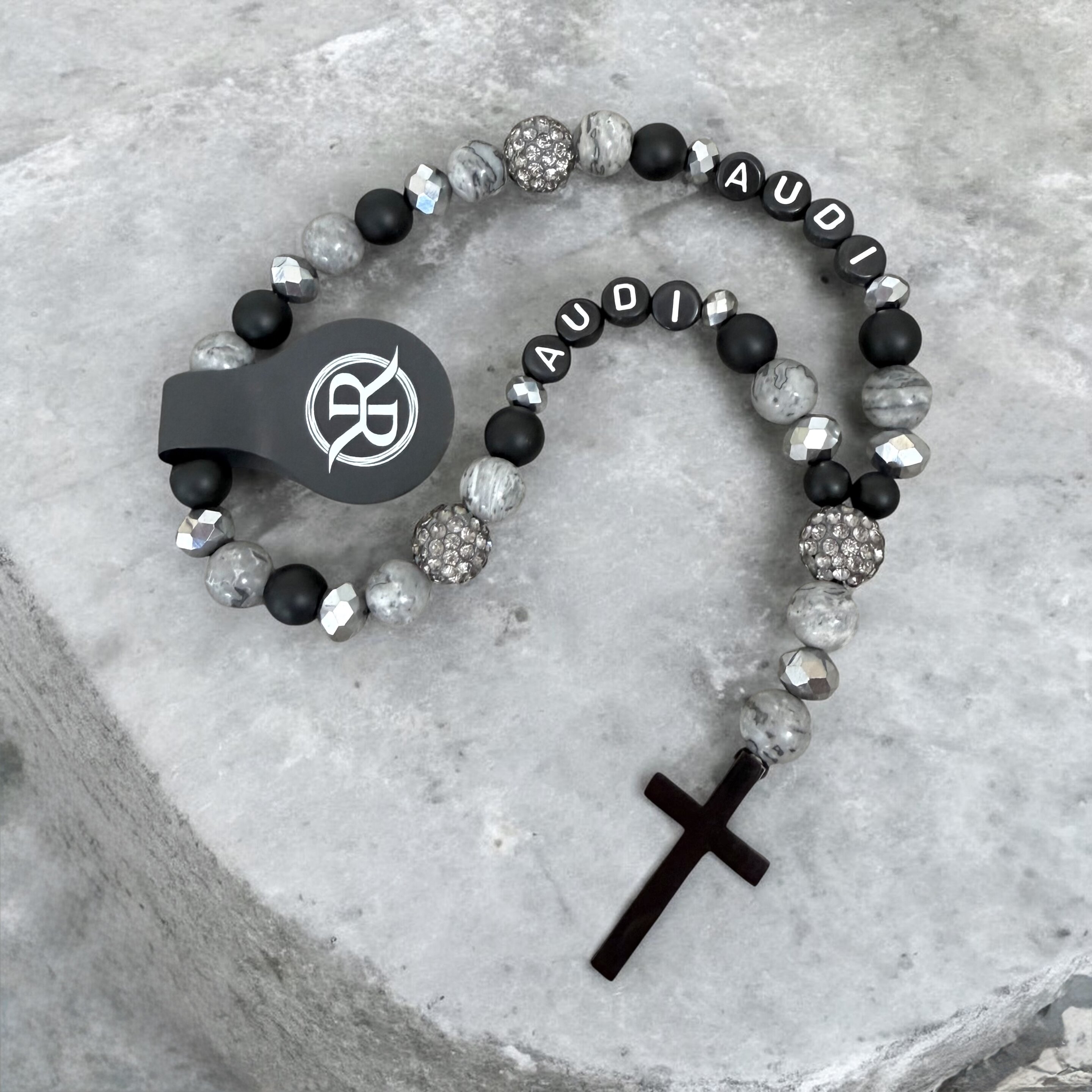 A rosary for the car, to hang on the rear-view mirror, made from natural stones