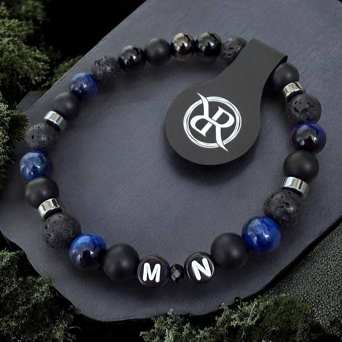 Aquamarine bracelet made from natural onyx, tiger’s eye, lava stones and haematite, with letters of your choice