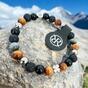 Bracelet made of natural stones with silver four-leaf clover for good luck