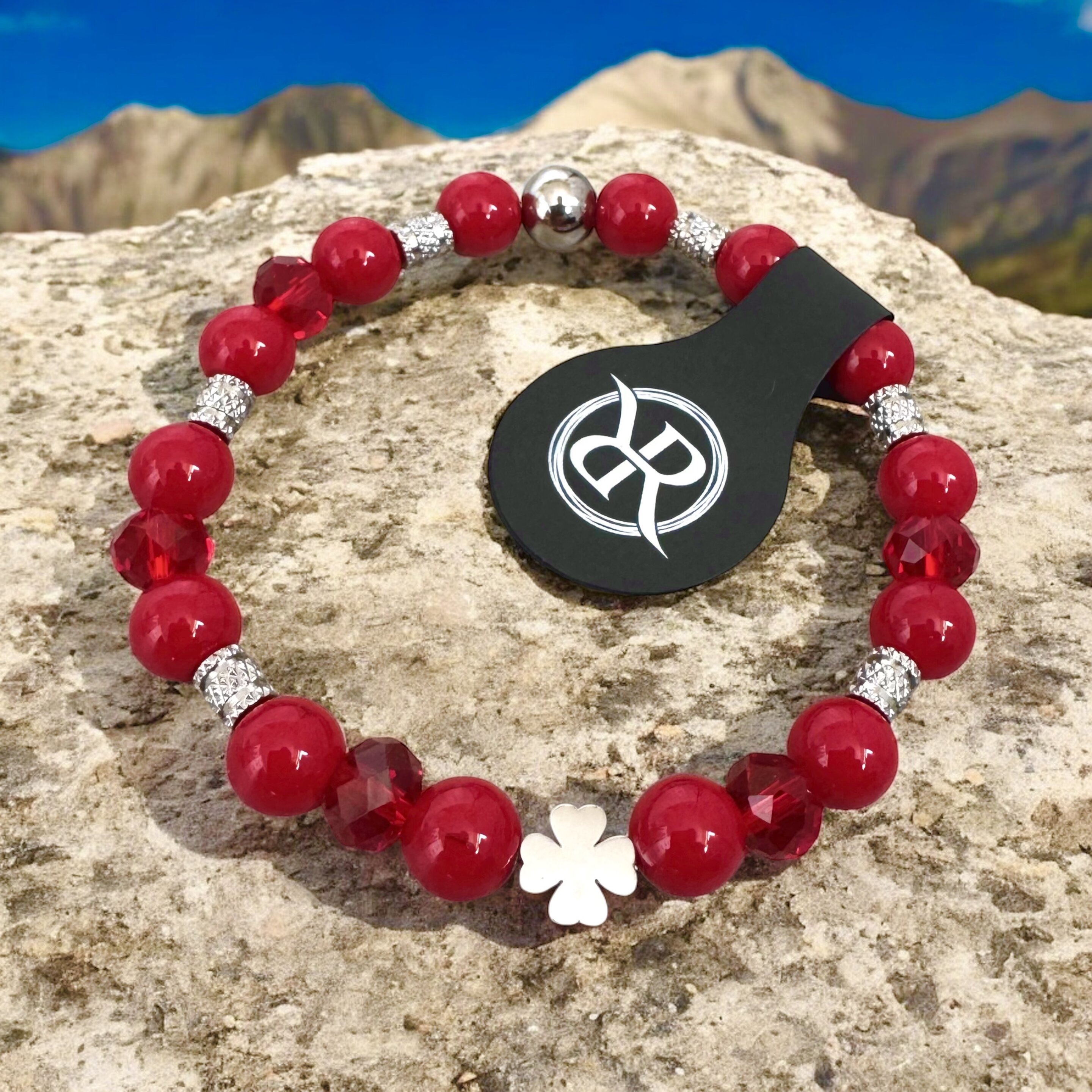 Bracelet made of red coral with four-leaf clover for luck