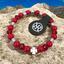 Bracelet made of red coral with four-leaf clover for luck