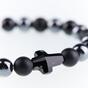 Bracelet with black swarovski cross made of natural stones