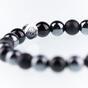 Bracelet with black swarovski cross made of natural stones
