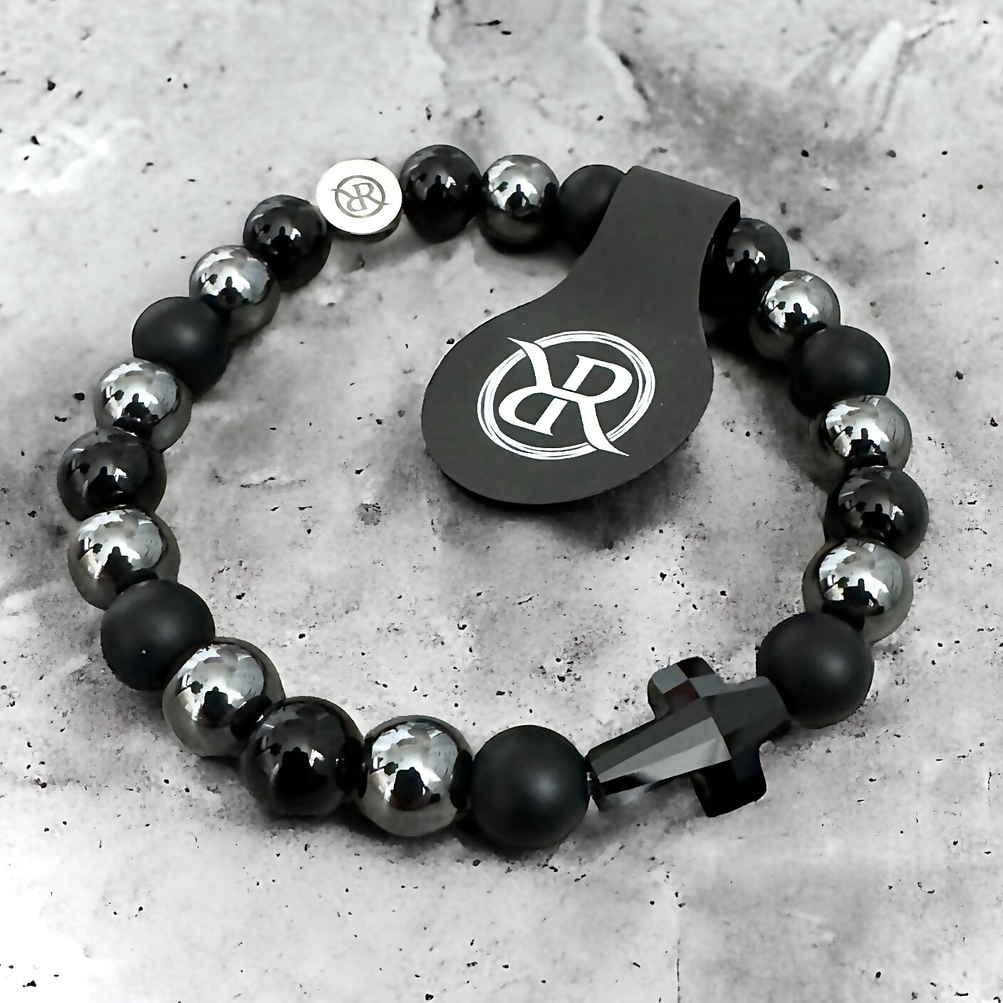 Bracelet with black swarovski cross made of natural stones