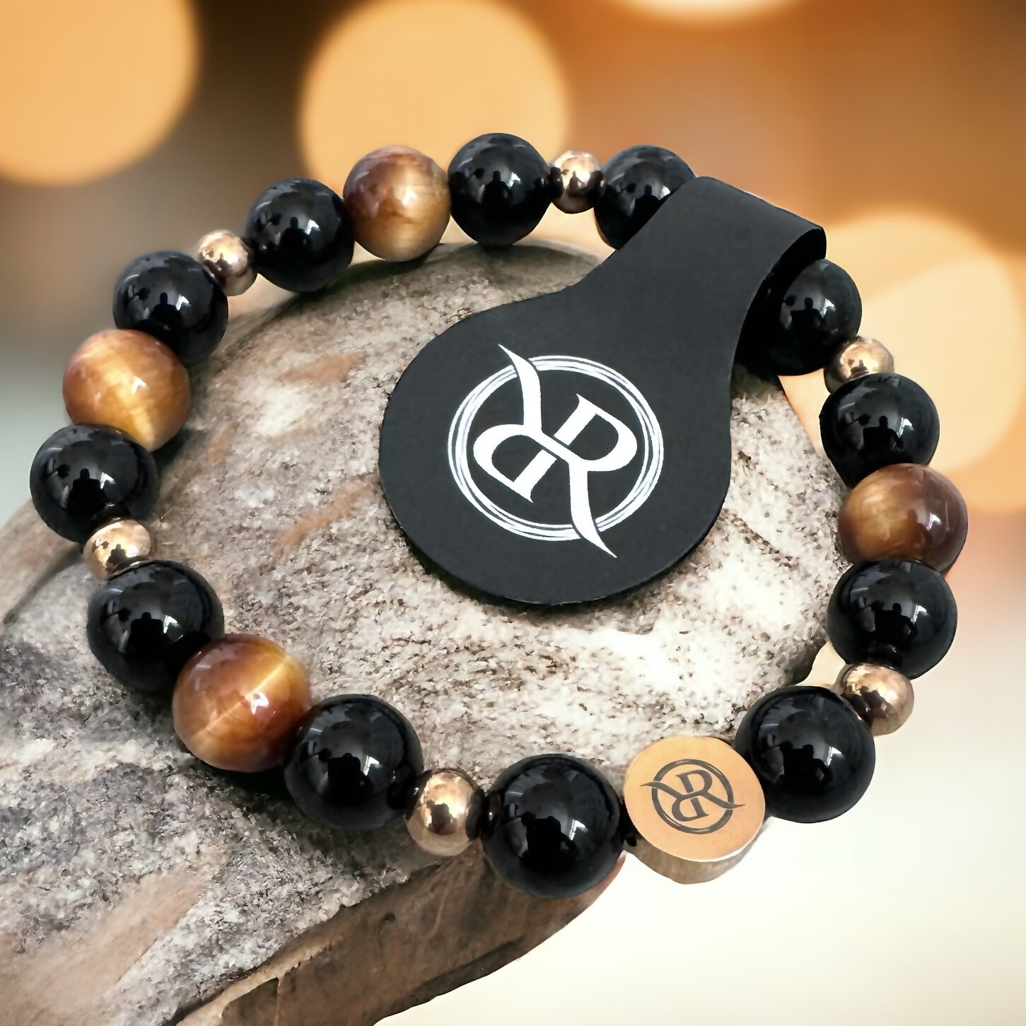 Bracelet with tiger eye, onyx and rose gold