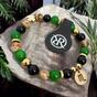 Bracelet with zodiac sign and golden four-leaf clover