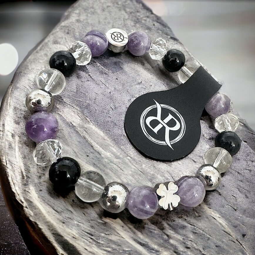 Protective bracelet with silver four-leaf clover