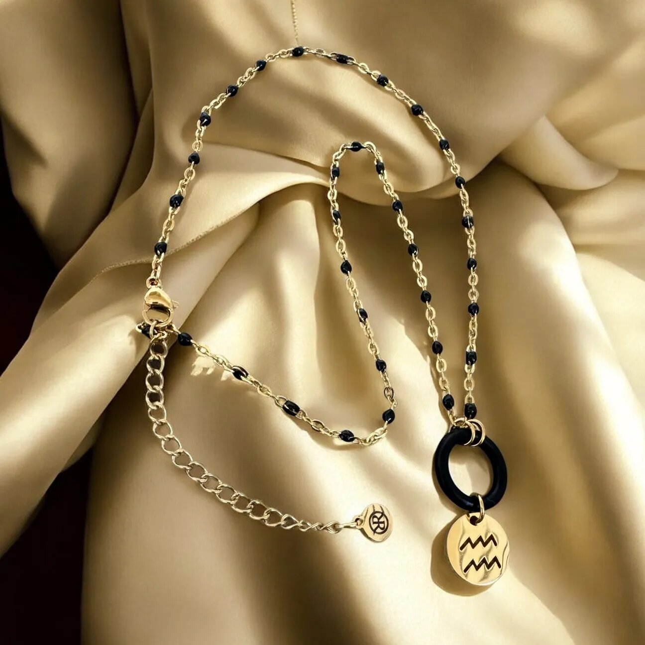 The minimalist Harmony necklace featuring a zodiac sign of your choice
