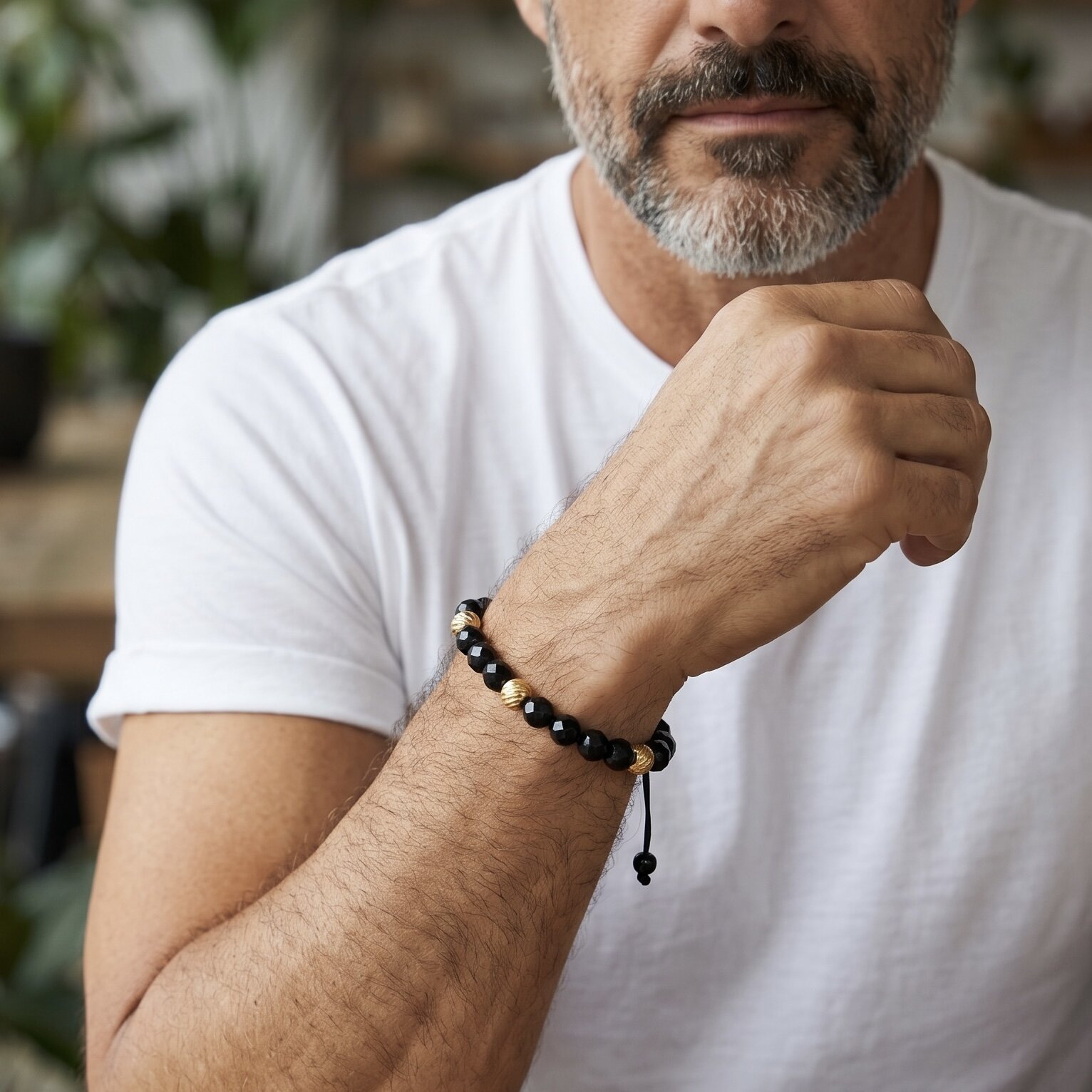 The Flavour bracelet, made with an adjustable clasp from natural onyx stones with gold beads